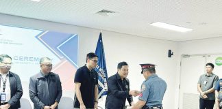 Office for Transportation Security undersecretary Gilbert DC Cruz presents a commendation to a Philippine National Police – Aviation Security Unit 6 officer during a simple awarding ceremony at the Iloilo International Airport, recognizing the unit’s swift and heroic response in neutralizing an unruly, armed passenger. PNP AVSEGROUP AVSEU6 FACEBOOK