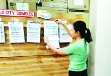 An election officer posts the List of Approved Voters on the bulletin board of the Office of the Election Officer–Iloilo City as part of the Commission on Elections’ verification process following the January 2026 Election Registration Board hearing and voter database cleanup. The list covers the period October 20 to December 30, 2025. COMELEC-ILOILO CITY FACEBOOK
