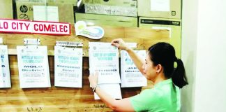 An election officer posts the List of Approved Voters on the bulletin board of the Office of the Election Officer–Iloilo City as part of the Commission on Elections’ verification process following the January 2026 Election Registration Board hearing and voter database cleanup. The list covers the period October 20 to December 30, 2025. COMELEC-ILOILO CITY FACEBOOK