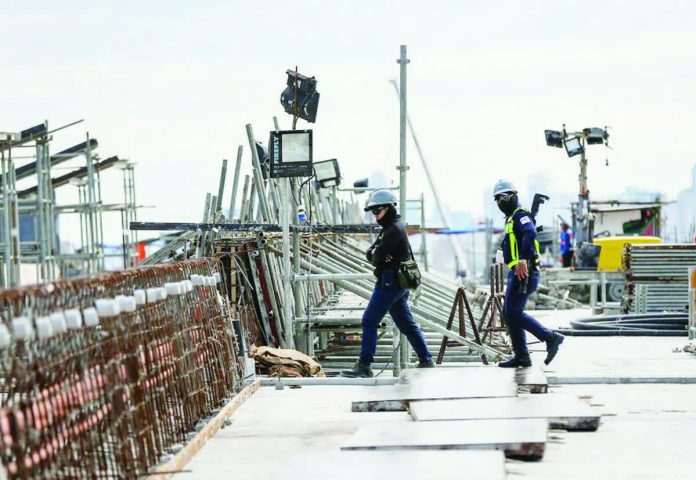 infra_sector_copy_resized_compressed Security personnel monitor the construction site of the NLEX-SLEX Connector in this file photo. The Philippine economy posted disappointing growth in 2025 following a sharp contraction in government infrastructure, according to Bank of America. JONATHAN CELLONA, ABS-CBN NEWS PHOTO