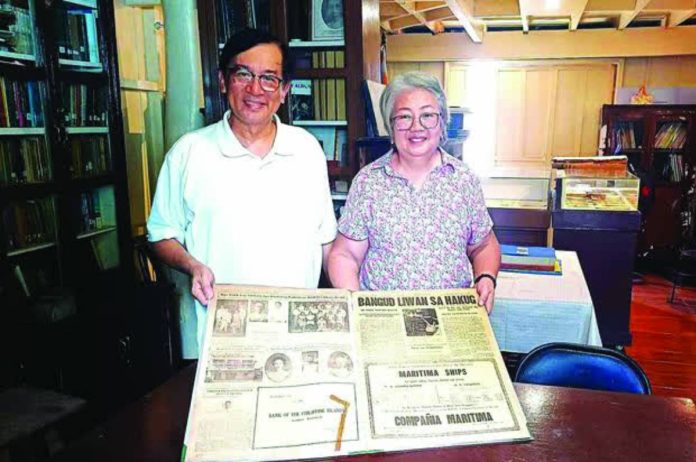 mai Maki copy_compressed Nick Deocampo (left), chairman of the Memory of the World Committee of the UNESCO National Commission of the Philippines, and Pilar Martinez (right) of Makinaugalingon Press display an original copy of the historic Hiligaynon newspaper now inscribed in the UNESCO Philippines Memory of the World National Register, underscoring efforts to preserve Iloilo’s documentary heritage.