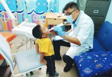 At the Jaro 2 Buntatala Day Care Center, a dentist from the Iloilo City Health Office check this learner’s teeth. Every year, children in day care centers undergo dental check-up, fluoride application, and toothbrush drills.