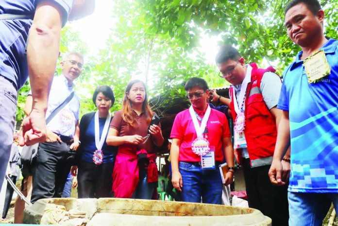 Representatives from the Asian Development Bank, Department of Social Welfare and Development, and local officials conduct an on-site inspection of a KALAHI-CIDSS-funded facility in Barangay Matag-ub, Janiuay, Iloilo, as part of a technical field review for the Philippine Community Resilience Project. DSWD-6 PHOTO