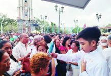 Church warns faithful vs ritualism; Candelaria fiesta draws thousands A young seminarian gently presses the image of Nuestra Señora de la Candelaria onto the head of a devotee during the traditional palapak ritual on the grounds of the Jaro Metropolitan Cathedral in Jaro, Iloilo City, as thousands line up in prayerful devotion during the Candelaria Fiesta yesterday. NELJOY GALIGAO/PN