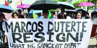 Youth protesters hold a bold banner reading “Marcos Duterte Resign” during the EDSA@40 prayer rally in Iloilo City on February 25, 2026, as demonstrators call for accountability and an end to corruption. AJ PALCULLO/PN