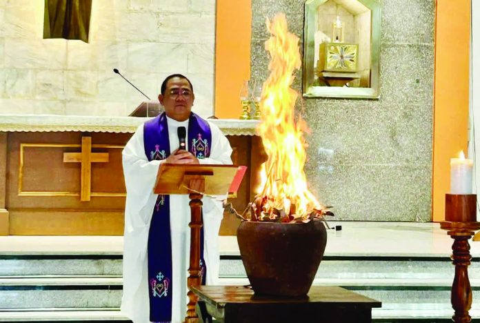 Reverend Father Angelo Colada, spokesperson and director of Archdiocese of Jaro’s Social Communication Office, leads the burning of blessed palms to prepare ashes for Ash Wednesday rites, signalling the start of the Lenten season in Iloilo City. PHOTO FROM ARCHDIOCESE OF JARO, COMMISSION ON SOCIAL COMMUNICATIONS