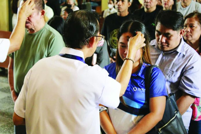 The faithful receive ashes on their foreheads during Ash Wednesday rites at the Jaro Metropolitan Cathedral in Iloilo City, marking the solemn start of the Lenten season with a call to repentance, humility, and spiritual renewal. AJ PALCULLO/PN