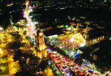 An aerial night view shows thousands of devotees filling the Jaro Metropolitan Cathedral grounds and surrounding streets in Iloilo City for the Solemn Coronation of Nuestra Señora de la Candelaria on the eve of her feast day, as candlelight, prayers, and city lights merge into a powerful display of Ilonggo devotion. ARCHDIOCESE OF JARO / COMMISSION ON SOCIAL COMMUNICATIONS