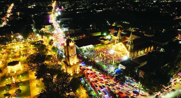 An aerial night view shows thousands of devotees filling the Jaro Metropolitan Cathedral grounds and surrounding streets in Iloilo City for the Solemn Coronation of Nuestra Señora de la Candelaria on the eve of her feast day, as candlelight, prayers, and city lights merge into a powerful display of Ilonggo devotion. ARCHDIOCESE OF JARO / COMMISSION ON SOCIAL COMMUNICATIONS