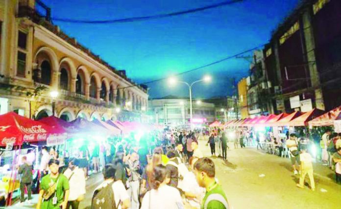 neljoy_night_market_copy_resized_compressed A festive crowd filled Calle Real during the inaugural Iloilo City Night Market held in 2024 as part of the Iloilo Charter Day celebration. The three-night event featured over 100 food stalls, marking the city’s first large-scale night market. Photo courtesy of Ma. Theresa Ladiao/PN
