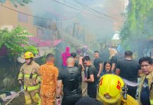 OBSTRUCTIONS DELAY BFP FIRE RESPONSE; Clogged streets, dangling wires put lives at risk Narrow streets and low-hanging power lines hampered firefighting efforts during a blaze in Barangay Benedicto, Jaro, Iloilo City, on Feb. 16, 2026. AJ PALCULLO/PN