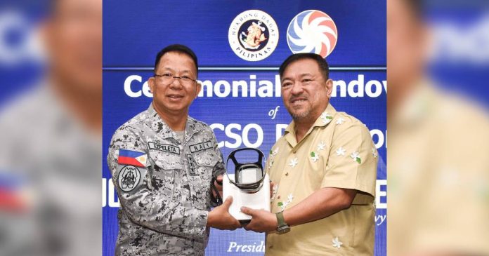 MINI MARVEL. PCSO General Manager Mel Robles turns over an ultra- modern portable AI X-Ray Unit to Vice Admiral Jose Ma. Ambrosio Ezpeleta during a recent simple handover ceremony at PN Headquarters in Manila. ( PCPO Media Bureau)