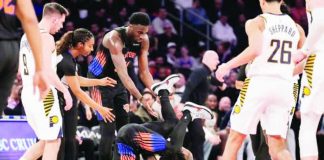 New York Knicks guard Jose Alvarado fights for control of the ball with Indiana Pacers guard Quenton Jackson. AP/YUKI IWAMURA