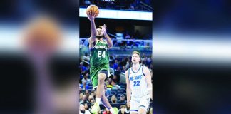 Milwaukee Bucks guard Cameron Thomas soars for a layup. AP