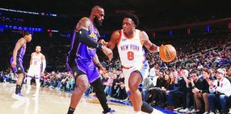 New York Knicks’ OG Anunoby dribbles the ball against the defense of Los Angeles Lakers' LeBron James. ESPN PHOTO