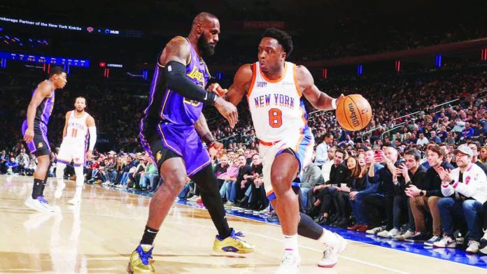 New York Knicks’ OG Anunoby dribbles the ball against the defense of Los Angeles Lakers' LeBron James. ESPN PHOTO
