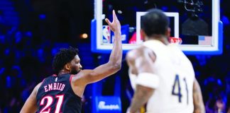 Philadelphia 76ers center Joel Embiid gestures after making a three-pointer against New Orleans Pelicans. AP