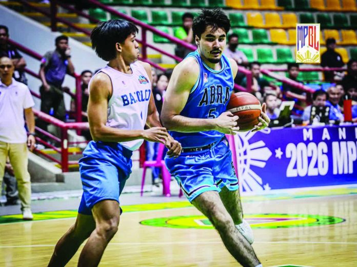 sports_Molina_copy_resized_compressed Tucker Molina throws down one of his two momentum-shifting dunks in a rousing debut for the Abra Solid North Weavers in the MPBL Preseason Invitational. MPBL PHOTO