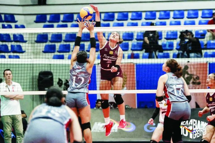 University of Perpetual Help Lady Altas’ Cyrille Almeniana unloads a powerful hit against the Lyceum of the Philippines University Lady Pirates’ defense during their NCAA Season 101 clash at the San Andres Sports Complex. NCAA PHOTO