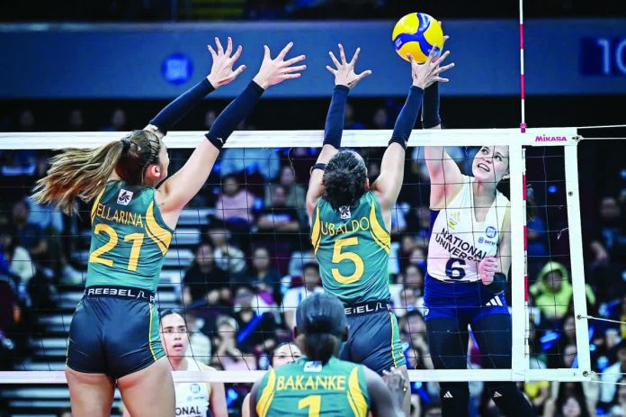 sports_NU_resized_compressed National University Lady Bulldogs' Evangeline Alinsug scores against the defense of Far Eastern University Lady Tamaraws' Tin Ubaldo. UAAP PHOTO