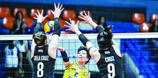 Capital1 Solar Energy Solar Spikers’ Sydney Niegos attempts to score against the defense of Farm Fresh Foxies’ Jolina dela Cruz. PVL PHOTO