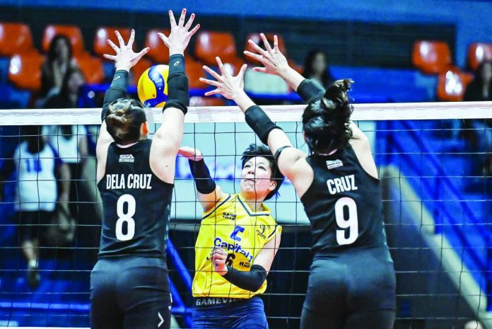 sports_Niegos_resized_compressed Capital1 Solar Energy Solar Spikers’ Sydney Niegos attempts to score against the defense of Farm Fresh Foxies’ Jolina dela Cruz. PVL PHOTO