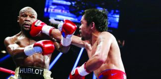 Manny Pacquiao lands a punch against Floyd Mayweather Jr. during their first encounter on May 3, 2015 at the MGM Grand Garden Arena in Las Vegas. PHOTO COURTESY OF ESTHER LIM/SHOWTIME