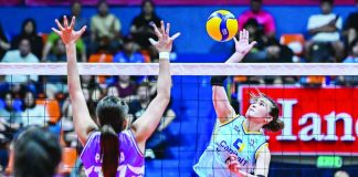 Mhicaela Belen of Capital1 Solar Energy Solar Spikers powers through the defense of Lorraine Pecana of Choco Mucho Flying Titans during their PVL All-Filipino Conference clash. PVL PHOTO