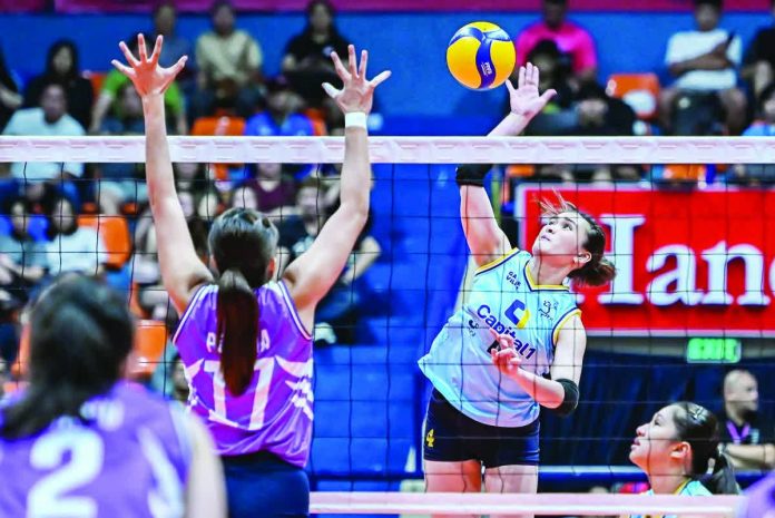 sports_Solar_resized_compressed Mhicaela Belen of Capital1 Solar Energy Solar Spikers powers through the defense of Lorraine Pecana of Choco Mucho Flying Titans during their PVL All-Filipino Conference clash. PVL PHOTO