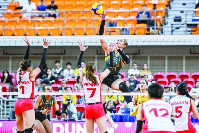 sports_Tamaraws_resized_compressed Far Eastern University’s Jaz Ellarina rises for an attack against the University of the East defense during their UAAP Season 88 women’s volleyball clash at the UST Quadricentennial Pavilion. UAAP PHOTO