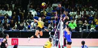 University of Santo Tomas Golden Tigresses’ Xyza Gula soars for a powerful hit. UAAP PHOTO