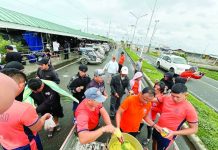 Officers of the Coast Guard Station Iloilo distributed hot meals to stranded passengers at Dumangas Port in Dumangas, Iloilo, on Friday, Feb. 6, 2026. The Coast Guard District Western Visayas recorded 1,292 stranded passengers, drivers, and cargo helpers as of 12 noon Friday due to the continued suspension of sea trips across the region due to Tropical Depression “Basyang.” COAST GUARD STATION ILOILO PHOTO