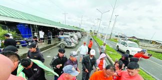 Officers of the Coast Guard Station Iloilo distributed hot meals to stranded passengers at Dumangas Port in Dumangas, Iloilo, on Friday, Feb. 6, 2026. The Coast Guard District Western Visayas recorded 1,292 stranded passengers, drivers, and cargo helpers as of 12 noon Friday due to the continued suspension of sea trips across the region due to Tropical Depression “Basyang.” COAST GUARD STATION ILOILO PHOTO