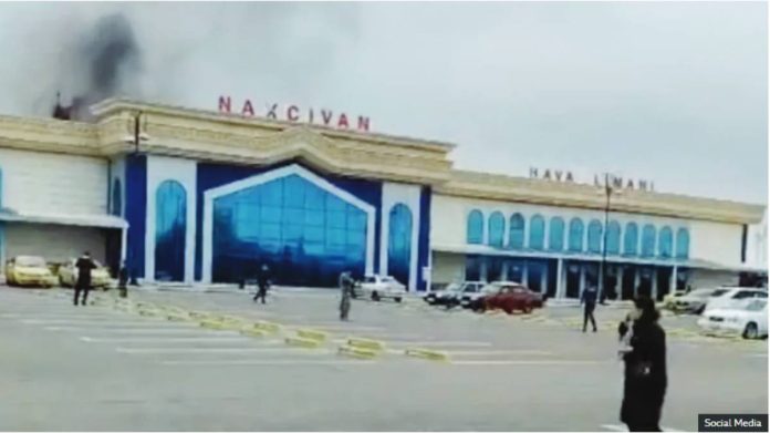 Smoke rises following a drone explosion at the airport of Nakhchivan, Azerbaijan, in this screengrab obtained from a social media video. SOCIAL MEDIA
