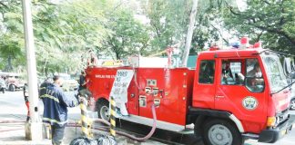Firemen wait for their truck to be filled with water from a fire hydrant along Visayas Avenue in Quezon City. March is declared as Fire Prevention Month" under Proclamation 115-A signed by former President Ferdinand Marcos. PNA