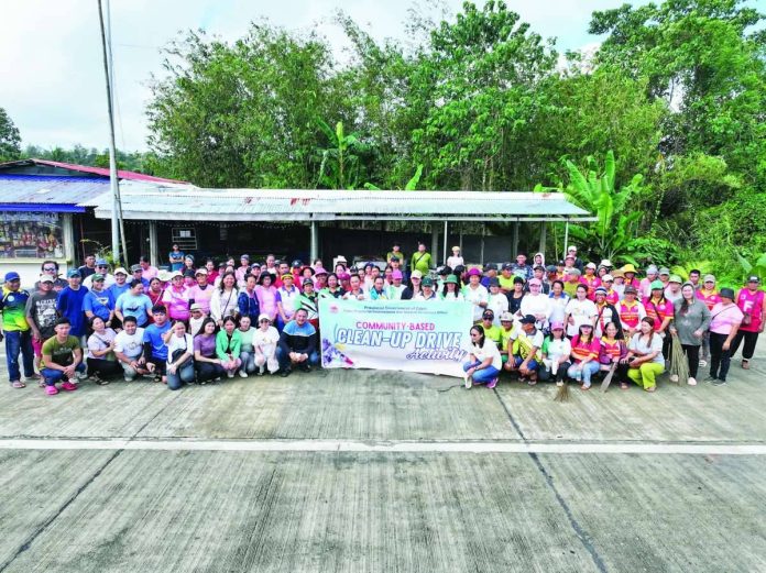 Capiz_cleanup_copy_compressed_resized Personnel from CaPENRO and MENRO, joined by volunteers and 4Ps beneficiaries, collect plastic and other waste materials during a community-based clean-up drive along New Road in Pontevedra, Capiz, where a total of 297.7 kilograms of garbage were gathered. CAPENRO PHOTO