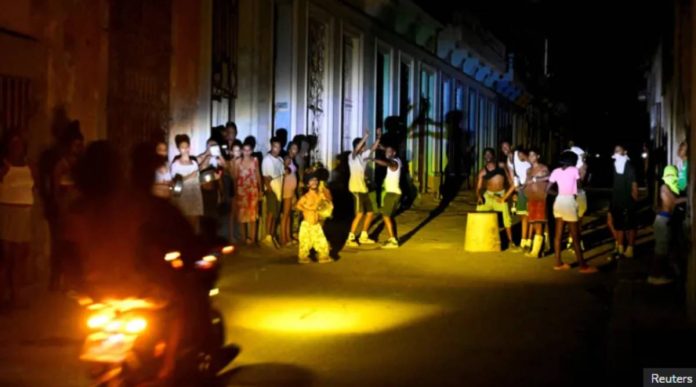 Cuba People gather on a street during a blackout as Cuba’s national electric grid collapsed, according to the country's grid operator. Power cuts leave millions of homes and businesses without power across the country. REUTERS
