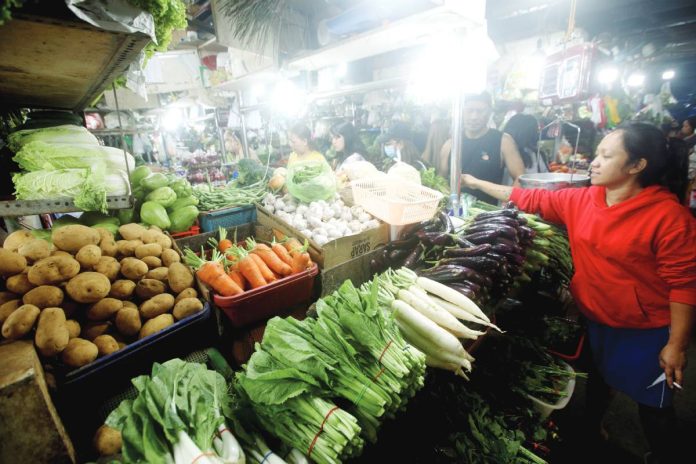 DTI price copy Fresh vegetables fill a stall at the Paco Public Market in Manila. President Ferdinand R. Marcos urged local government units to remove “pass-through fees” on vehicles transporting agricultural products and essential goods, saying the charges contribute to higher food prices. PNA