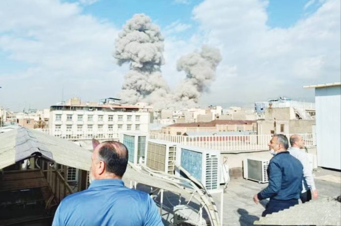 Iran VOLATILE SITUATION. People watch as smoke rises on the skyline after an explosion in Tehran, Iran. The United States and Israel continue pounding Iran with airstrikes even after the killing of Iran’s Supreme Leader Ayatollah Ali Khamenei. The strikes opened a stunning new chapter in US intervention in Iran and marked the second time in eight months that the Trump administration has used military force against the Islamic Republic. AP