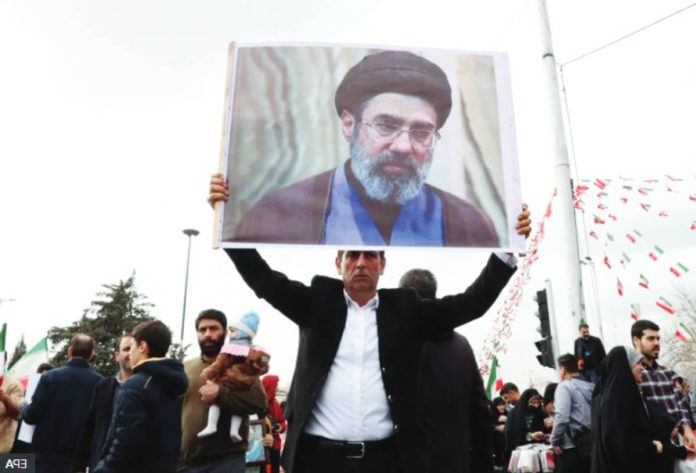 Iran An Iranian man holds a picture of Mojtaba Khamenei as he takes part in celebrations of the 47th anniversary of the Islamic Revolution in Tehran, Iran, on February 11, 2026. EPA