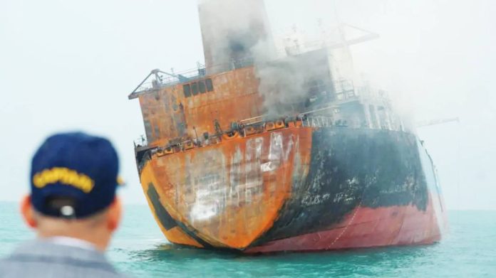 Daylight reveals a damaged tanker off the Iraqi coast after a missile strike by Iran. BBC