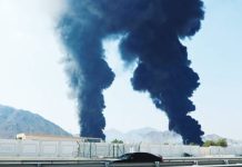 Iran hits key UAE oil Port, Dubai airport Smoke rises in the Fujairah oil industry zone, caused by debris after interception of an Iranian drone by air defenses of the United Arab Emirates. REUTERS