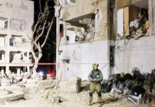 Iranian missiles injure 160 in towns near Israeli nuclear site A large Iranian missile shattered apartment blocks in Arad, southern Israel. REUTERS