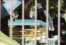 Mexican drug lord buried in golden coffin Mourners - some of them wearing surgical masks - look on as a gold-colored casket containing the body of cartel leader Nemesio Oseguera Cervantes, known as "El Mencho," is displayed during his funeral at the Recinto de la Paz cemetery in Zapopan, Mexico, on March 2, 2026. REUTERS
