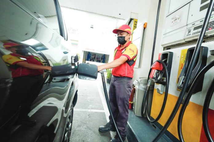 SUPPLY BOOST A fuel station attendant fills up a vehicle at a gas station along Timog Avenue in Quezon City. Facing the risk of a fuel supply disruption amid escalating tensions in the Middle East, President Ferdinand “Bongbong” Marcos Jr. has ordered diplomatic engagement with Iran to secure the safe passage of Philippine-bound oil shipments through the Strait of Hormuz. PNA