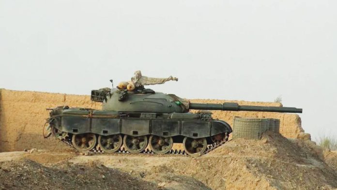 A tank is seen near a wall along the border in Chaman, Pakistan. AFP via Getty Images