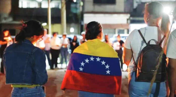 Venezuela Relatives of political prisoners hold candles and posters during a vigil in Zamora, Venezuela. MIGUEL GUTIÉRREZ/EPA/SHUTTERSTOCK
