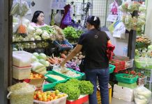 Fuel price surge not valid excuse to raise agri-fishery prices, says DA A customer browsing goods inside a market stall.