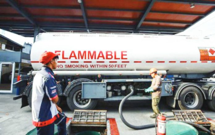 buffer supply An oil tanker replenishes the underground storage tank of a gasoline station in Quezon City on March 9, 2026. Finance Secretary Frederick Go said Tuesday, March 17, 2026, that the PNOC Exploration Corporation will procure 2 million barrels of oil to increase the country's buffer stock. PNA PHOTO BY JOAN BONDOC