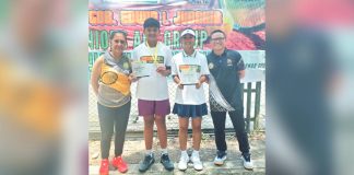 Kathlyn Bugna and Kresthan Belacas display their trophies after delivering impressive performances in the Gov. Jubahib junior tennis tournament. CONTRIBUTED PHOTO